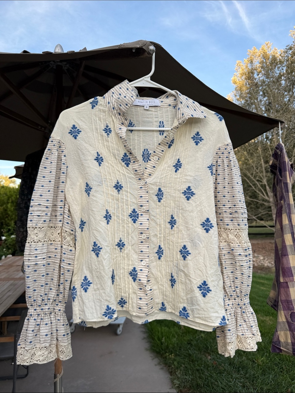 HUNTER BELL Cream Blouse with Blue Embroidered Motifs